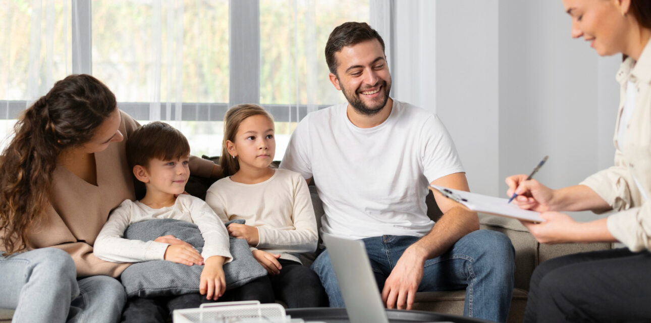 Family meeting with ABA therapist in home setting.