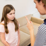 Parent setting a boundary with her autistic daughter.
