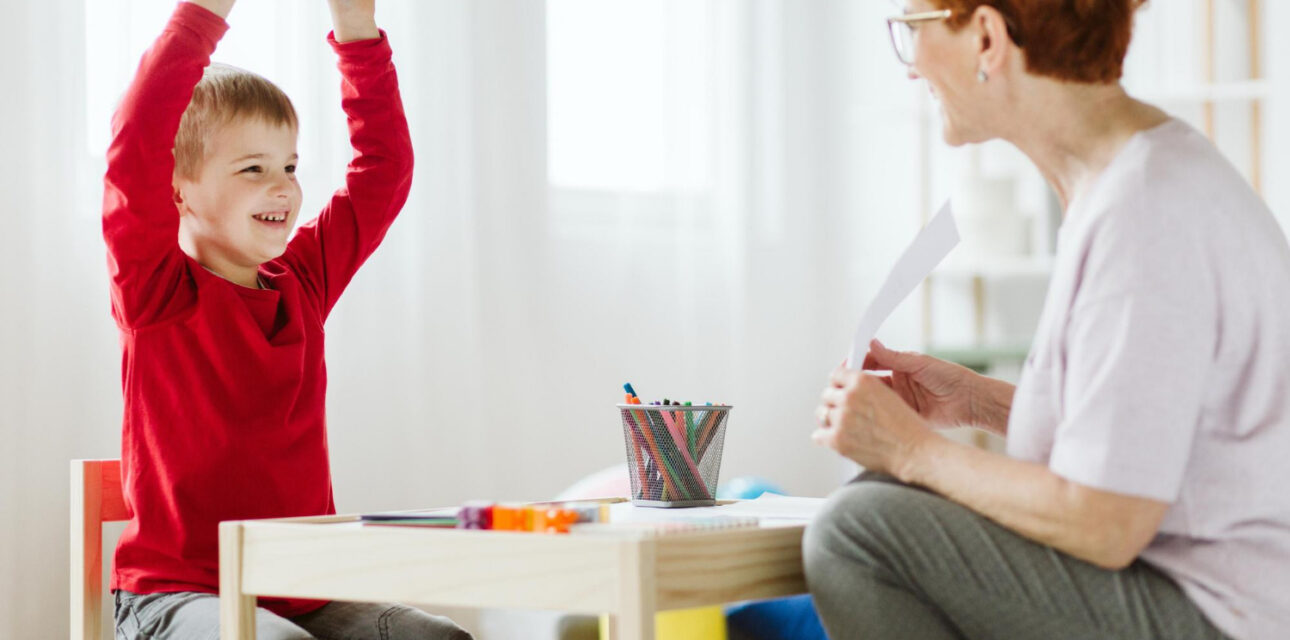 BCBA practices functional communication skills with an autistic child.