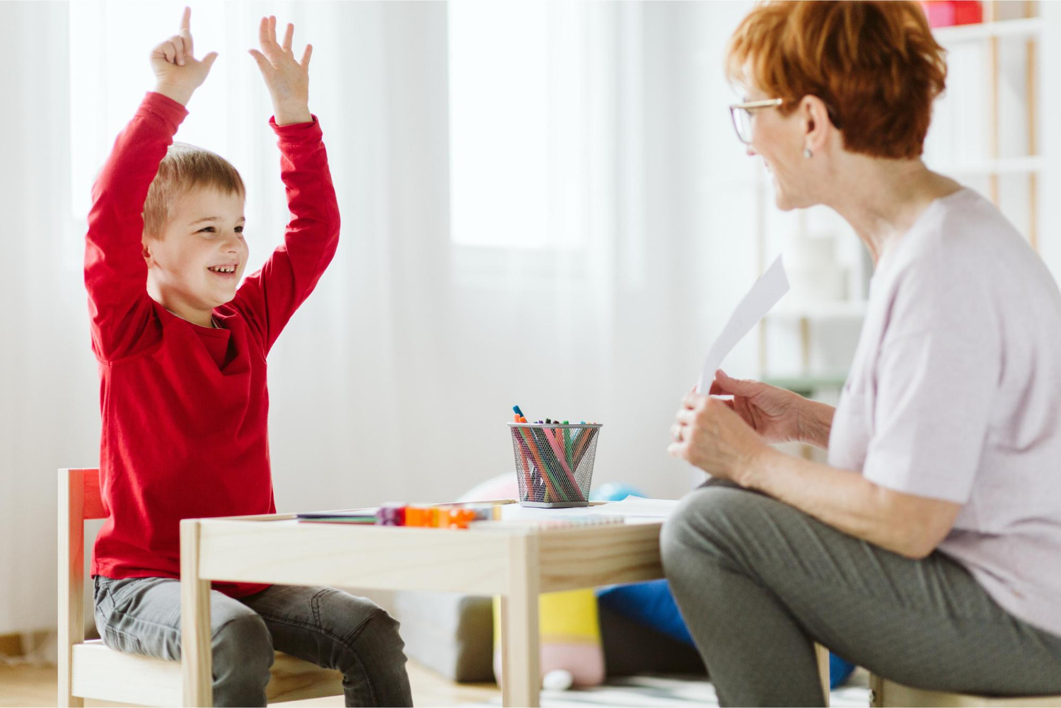 BCBA practices functional communication skills with an autistic child.