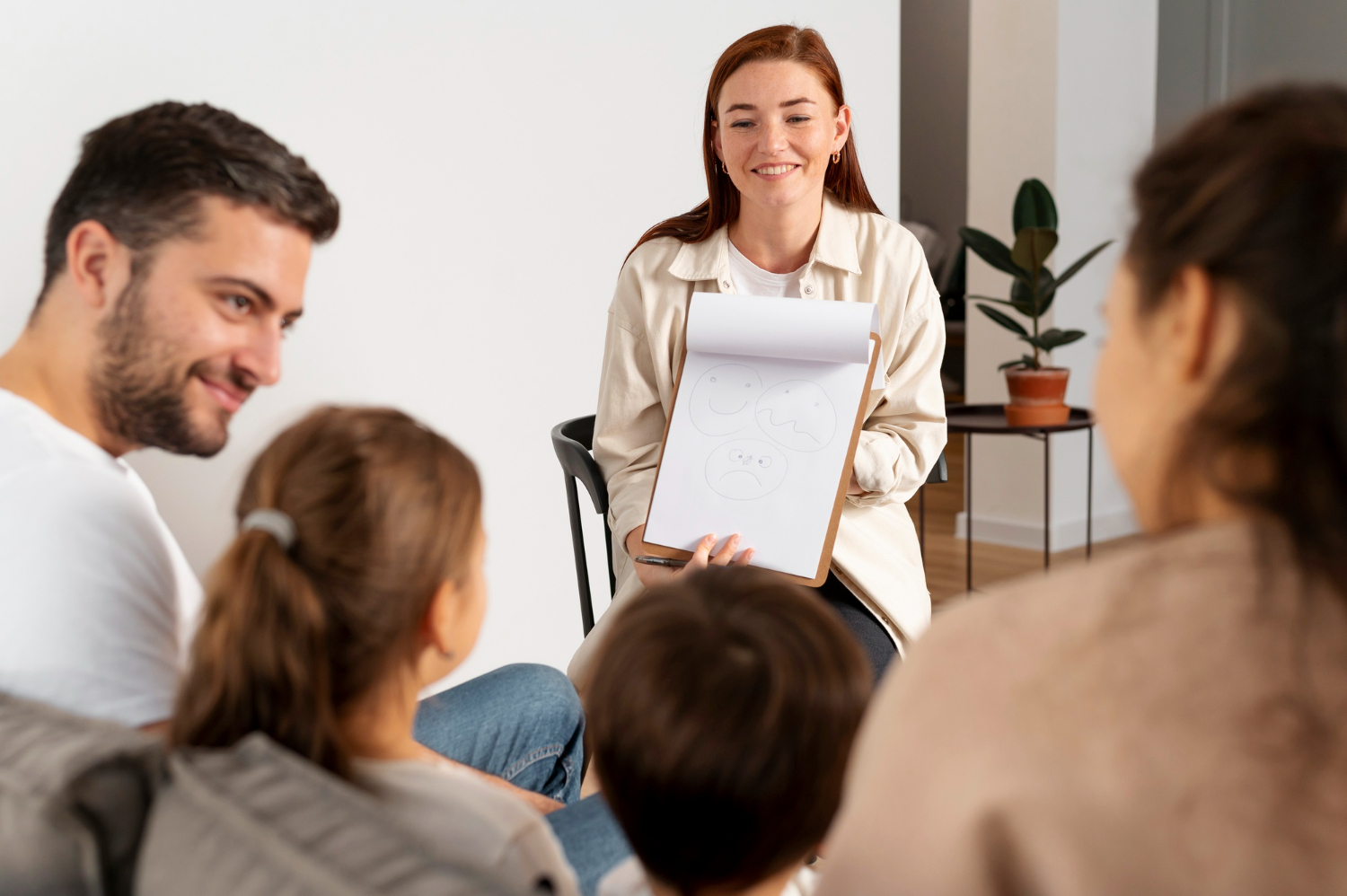 BCBA meeting with an autistic child and family.