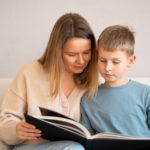 Parent supporting an autistic child with guidance from a BCBA.