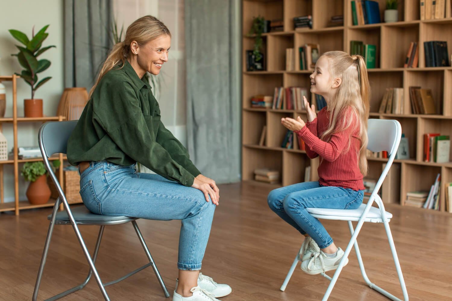 BCBA engaging with a child with autism during an ABA therapy session in a comfortable home setting.