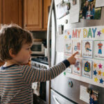 Child with autism using a visual daily routine chart.