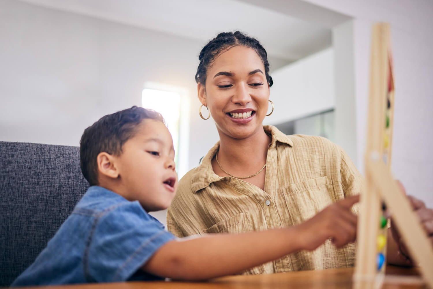 BCBA working with a child during an ABA therapy activity for autism support.