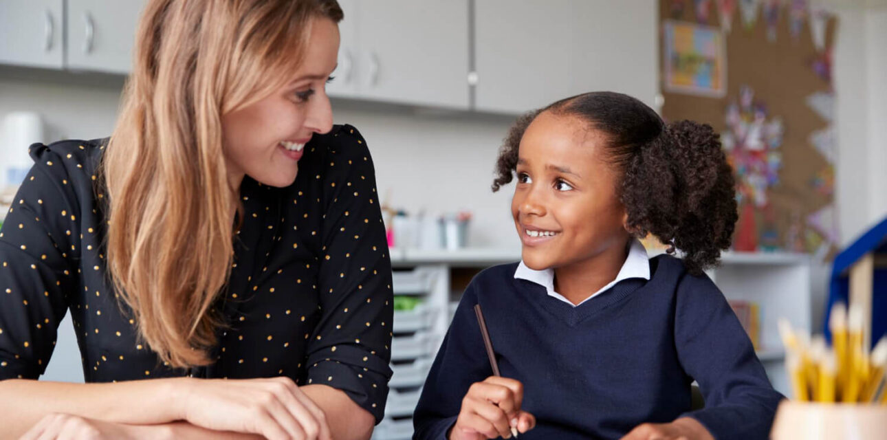 BCBA and young student during an ABA therapy activity focused on autism support.