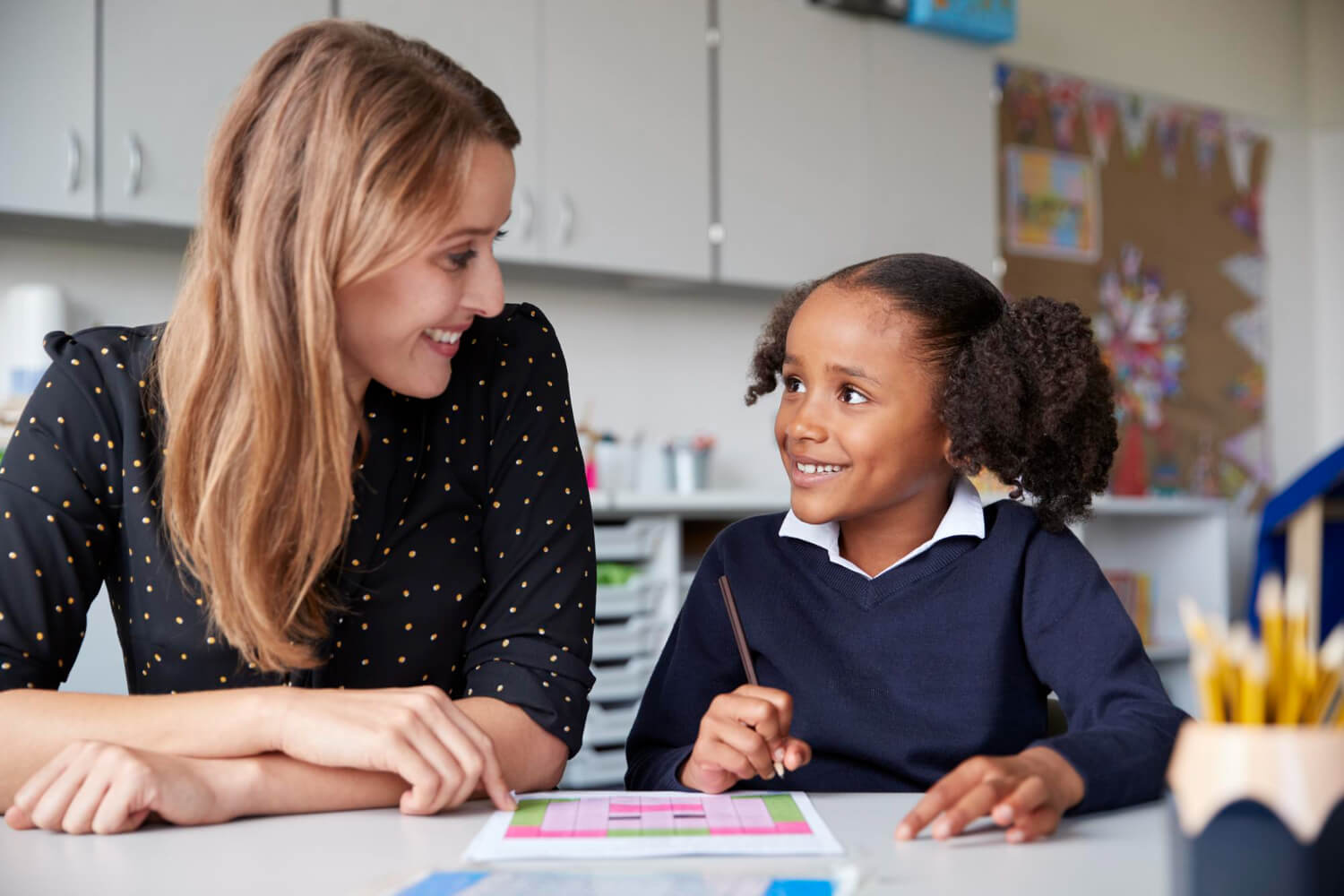 BCBA and young student during an ABA therapy activity focused on autism support.